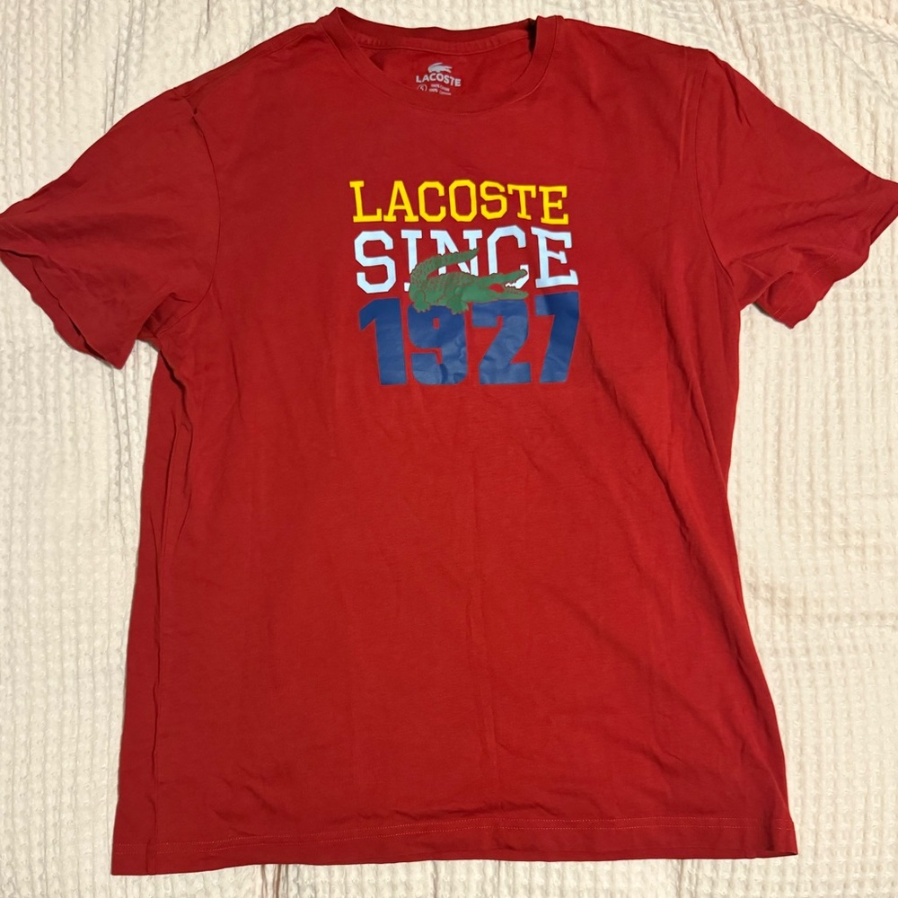Red Lacoste graphic tee, like new. Worn a couple times and stored for 15 years.